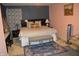 Comfortable bedroom with a plush bed, stylish decor, and ample natural light at 6056 Blackley Ct, Indianapolis, IN 46254