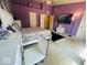 A bedroom with purple walls and modern decor at 6056 Blackley Ct, Indianapolis, IN 46254