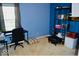 Blue Bedroom features a desk area, shelving, plush seating and carpeted floor at 6056 Blackley Ct, Indianapolis, IN 46254