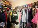Walk-in closet with ample storage, clothes racks, and shelves filled with shoes, clothes, and other accessories at 6056 Blackley Ct, Indianapolis, IN 46254
