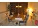 Traditional dining room with a stylish chandelier and a long table perfect for entertaining at 6056 Blackley Ct, Indianapolis, IN 46254
