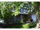 Traditional two-story home with inviting front porch and swing for relaxing outdoors at 6056 Blackley Ct, Indianapolis, IN 46254