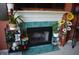 Charming fireplace with decorative tile surround and beautiful floral arrangements at 6056 Blackley Ct, Indianapolis, IN 46254
