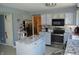 Bright kitchen with stainless steel appliances, center island, and stylish backsplash at 6056 Blackley Ct, Indianapolis, IN 46254