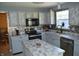 Modern kitchen features marble countertops, sleek appliances, and ample storage space at 6056 Blackley Ct, Indianapolis, IN 46254