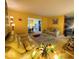 Bright living room with views to dining room, featuring stylish furnishings and neutral decor at 6056 Blackley Ct, Indianapolis, IN 46254
