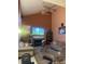 A spacious living room with a fireplace, a fan, and comfortable seating at 6056 Blackley Ct, Indianapolis, IN 46254