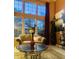 A well-lit living room with large windows, stylish furniture, and elegant decor at 6056 Blackley Ct, Indianapolis, IN 46254