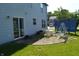 Back patio featuring a table with chairs, swing and a privacy screen for outdoor relaxing at 6056 Blackley Ct, Indianapolis, IN 46254