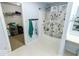 Bright blue bathroom featuring a bathtub with shower, offering a functional and tidy space at 6213 Selago Dr, Indianapolis, IN 46203
