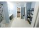 Bright bathroom features a shower/tub combo, single sink vanity and open doorway to the bedroom at 6213 Selago Dr, Indianapolis, IN 46203