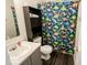 Bathroom featuring vanity sink and dinosaur shower curtain at 6213 Selago Dr, Indianapolis, IN 46203