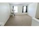 Carpeted bedroom with two windows, and a cat tree at 6213 Selago Dr, Indianapolis, IN 46203