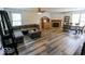 Comfortable living room featuring new flooring, a fireplace, and ample natural light at 6213 Selago Dr, Indianapolis, IN 46203