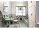 This vintage bathroom features unique green fixtures, grey tiling, and natural light at 6220 Spring Mill Rd, Indianapolis, IN 46260