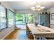 Charming dining room with windows that let in light, a light wood table, and a stylish hutch at 6220 Spring Mill Rd, Indianapolis, IN 46260