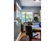 Bright dining area with natural light, vintage cabinet, and stylish decor at 6220 Spring Mill Rd, Indianapolis, IN 46260