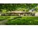 Charming brick ranch home with mature trees and well-manicured front yard at 6220 Spring Mill Rd, Indianapolis, IN 46260