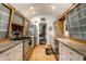 Modern kitchen featuring stainless steel appliances, wooden frame cabinets, and a convenient layout for easy meal preparation at 6220 Spring Mill Rd, Indianapolis, IN 46260