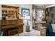 Open living space with piano, built-in shelves and a view of other living areas at 6220 Spring Mill Rd, Indianapolis, IN 46260
