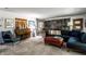 Inviting living room featuring a piano and comfortable seating arrangement at 6220 Spring Mill Rd, Indianapolis, IN 46260