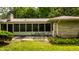 Charming patio with stone accents and a screened porch, perfect for outdoor dining and relaxation at 6220 Spring Mill Rd, Indianapolis, IN 46260
