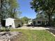 Exterior view of an open backyard featuring a shed and three-car garage at 71 W County Road 500 S, Clayton, IN 46118