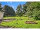 Backyard with a firepit in a grassy yard at 71 W County Road 500 S, Clayton, IN 46118