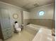 Bright bathroom featuring built-in tub, tiled surround, and octagonal window at 71 W County Road 500 S, Clayton, IN 46118