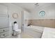 Bright bathroom featuring a tub, toilet, and tiled floors at 71 W County Road 500 S, Clayton, IN 46118