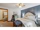Bright bedroom featuring a ceiling fan, blue accent wall and a guitar at 71 W County Road 500 S, Clayton, IN 46118