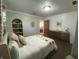 Neutral bedroom with Strawberry Shortcake themed bed, with vintage dresser at 71 W County Road 500 S, Clayton, IN 46118