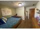 Olive green bedroom featuring world map, wooden dresser and bed at 71 W County Road 500 S, Clayton, IN 46118
