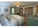 Bedroom with a queen bed, ceiling fan, and windows with curtains at 71 W County Road 500 S, Clayton, IN 46118