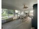 Bright sunroom with dining area features large windows and views of the garden at 71 W County Road 500 S, Clayton, IN 46118