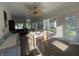 Sunlit dining room with a white table, chairs, and large windows at 71 W County Road 500 S, Clayton, IN 46118