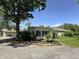Single-story home with a sunroom addition featuring multiple windows and a landscaped yard at 71 W County Road 500 S, Clayton, IN 46118