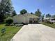 Charming house with a covered porch, rocking chairs, and a spacious concrete driveway at 71 W County Road 500 S, Clayton, IN 46118