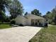 Home featuring a well-manicured lawn, front porch with rocking chairs, and a paved driveway at 71 W County Road 500 S, Clayton, IN 46118
