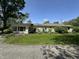 Single-story home featuring lush front yard and a combination of vinyl siding and large windows at 71 W County Road 500 S, Clayton, IN 46118