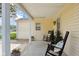 Inviting covered porch with rocking chairs and views of the front yard at 71 W County Road 500 S, Clayton, IN 46118