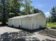 Detached three-car garage on a property with a side entry door at 71 W County Road 500 S, Clayton, IN 46118