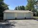 Spacious three-car garage with ample parking and storage, perfect for car enthusiasts or hobbyists at 71 W County Road 500 S, Clayton, IN 46118