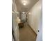 Hallway featuring a table with a lamp and a view into another room at 71 W County Road 500 S, Clayton, IN 46118