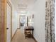Hallway with neutral walls, wood trim, and a view into the living room at 71 W County Road 500 S, Clayton, IN 46118