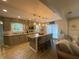 Stylish kitchen featuring gray cabinets, a large central island with seating, and updated appliances at 71 W County Road 500 S, Clayton, IN 46118