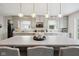 Bright kitchen with gray cabinetry, modern appliances, and a large center island with seating and pendant lighting at 71 W County Road 500 S, Clayton, IN 46118
