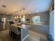 Spacious kitchen featuring a large island with seating, stainless steel appliances, and shaker style cabinets at 71 W County Road 500 S, Clayton, IN 46118