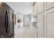 Bright kitchen area with white cabinets and shelving for storage; a stainless steel fridge is also visible at 71 W County Road 500 S, Clayton, IN 46118