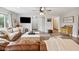 Cozy living room showcasing plush seating, a modern entertainment center and access to other rooms at 71 W County Road 500 S, Clayton, IN 46118